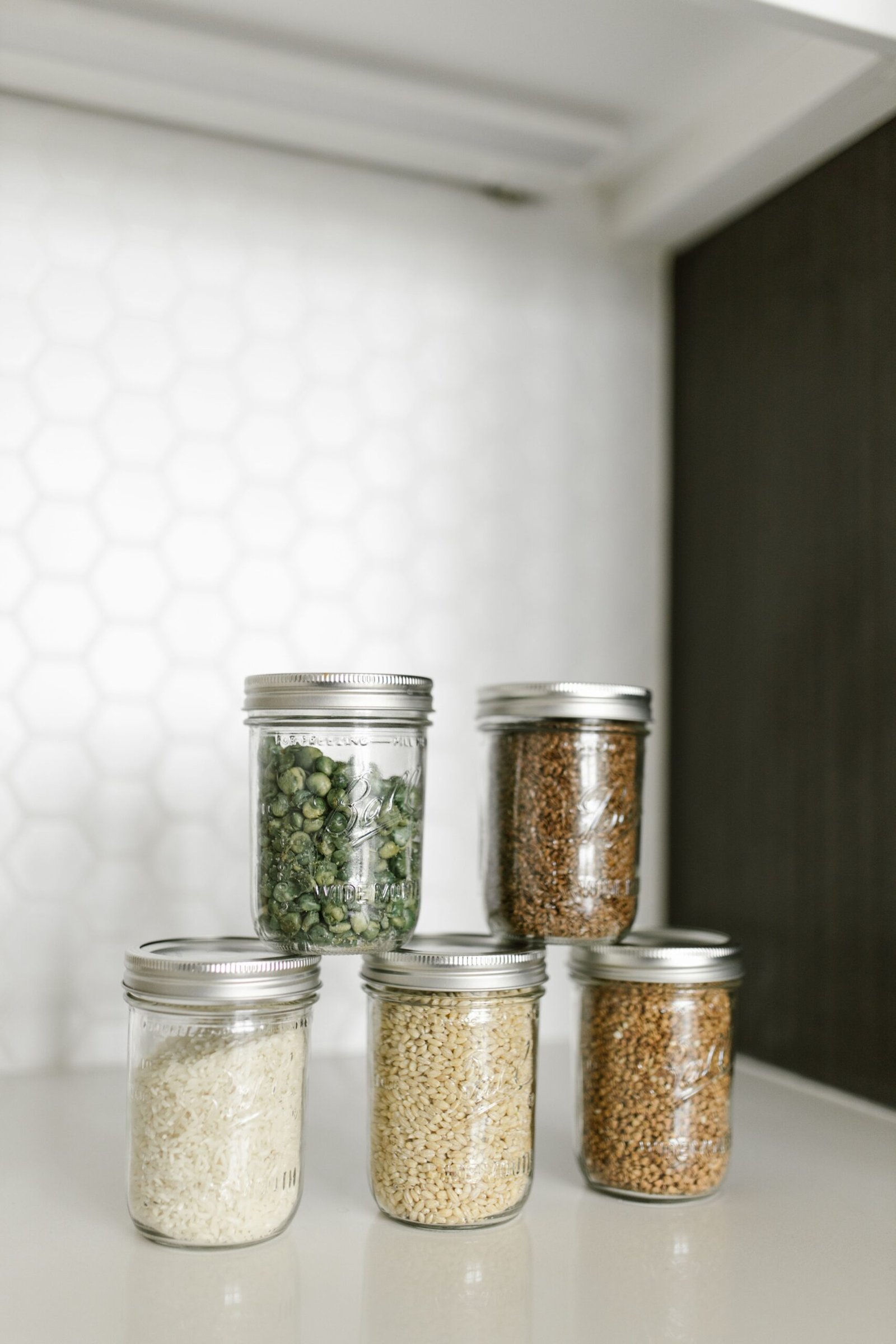 Glass jars on a tidy shelf