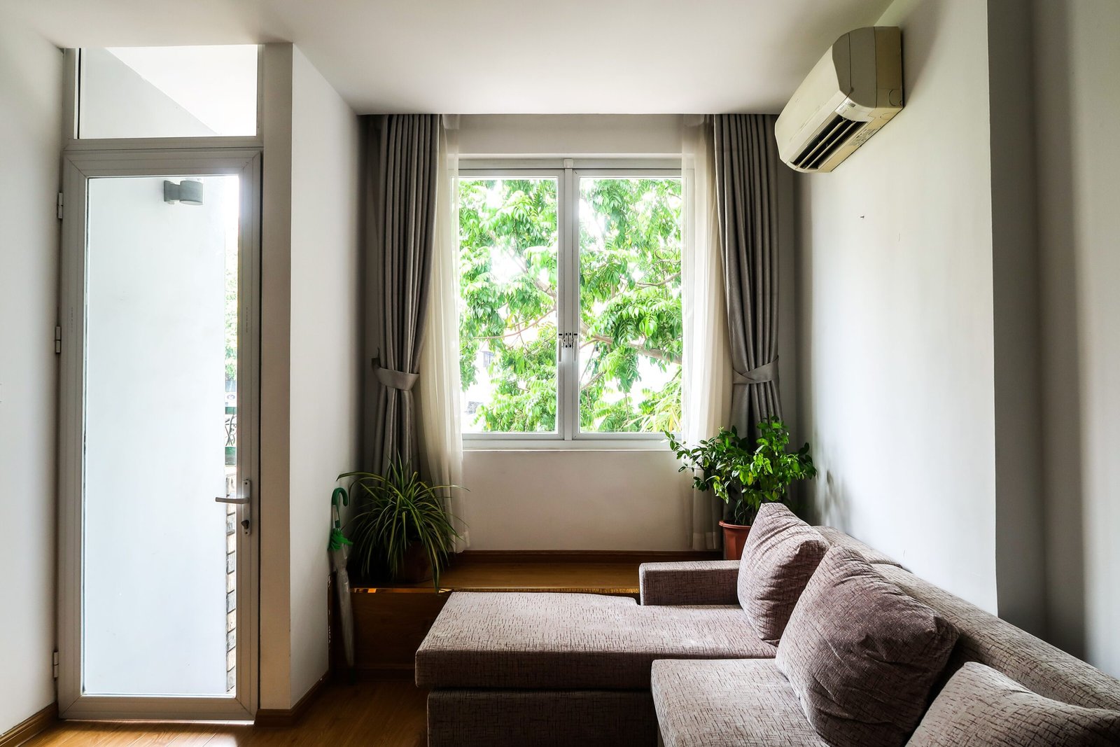 Bright sofa beside a window