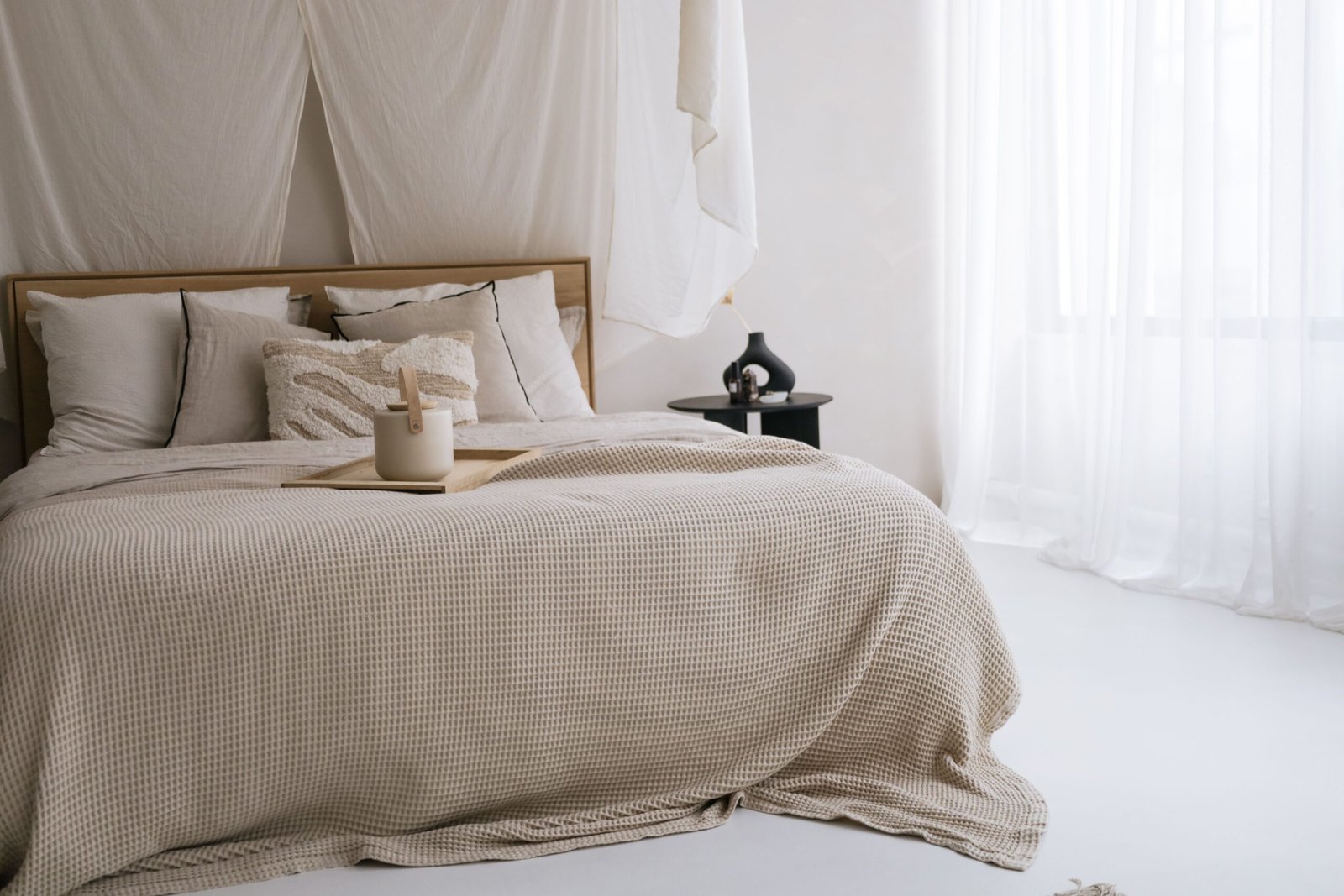 Softly styled bedroom with a neutral color palette