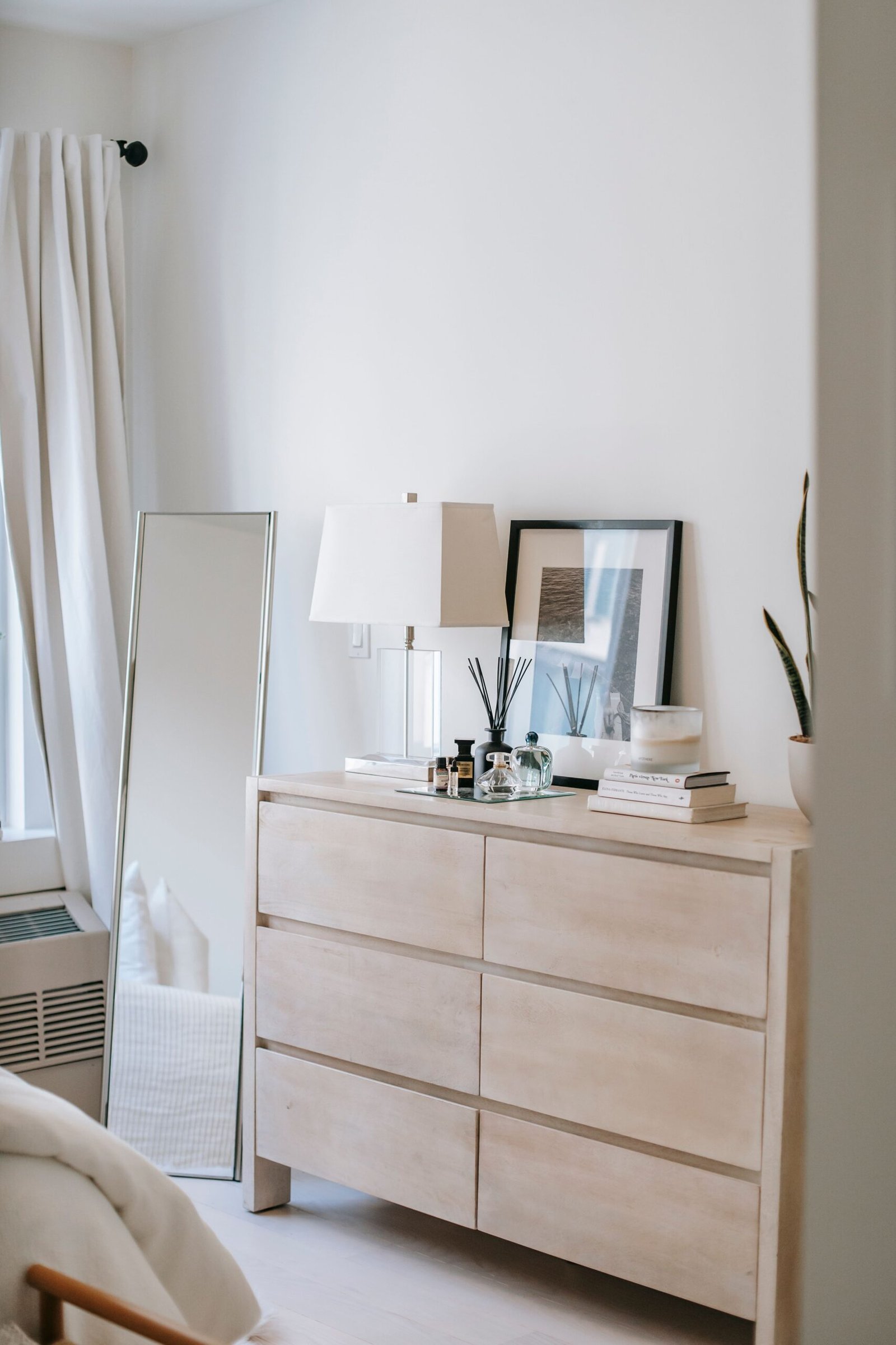 Wooden dresser with a mirror and tidy surface